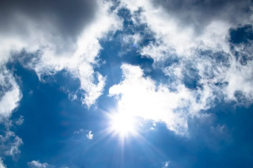 blue sunny sky with fluffy white clouds